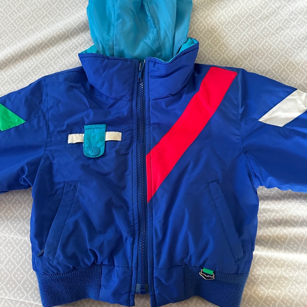 Obermeyer Kids Blue Puffer Jacket with Red and White Details